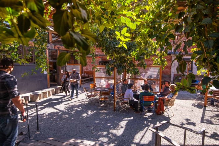 A view of people enjoying the Drake's Dealership Beer Garden