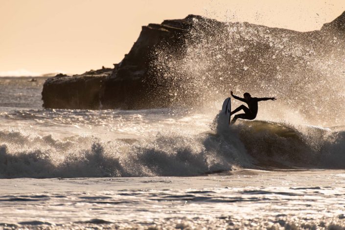 Surfer at Año Nuevo Reserve Carving a Wave